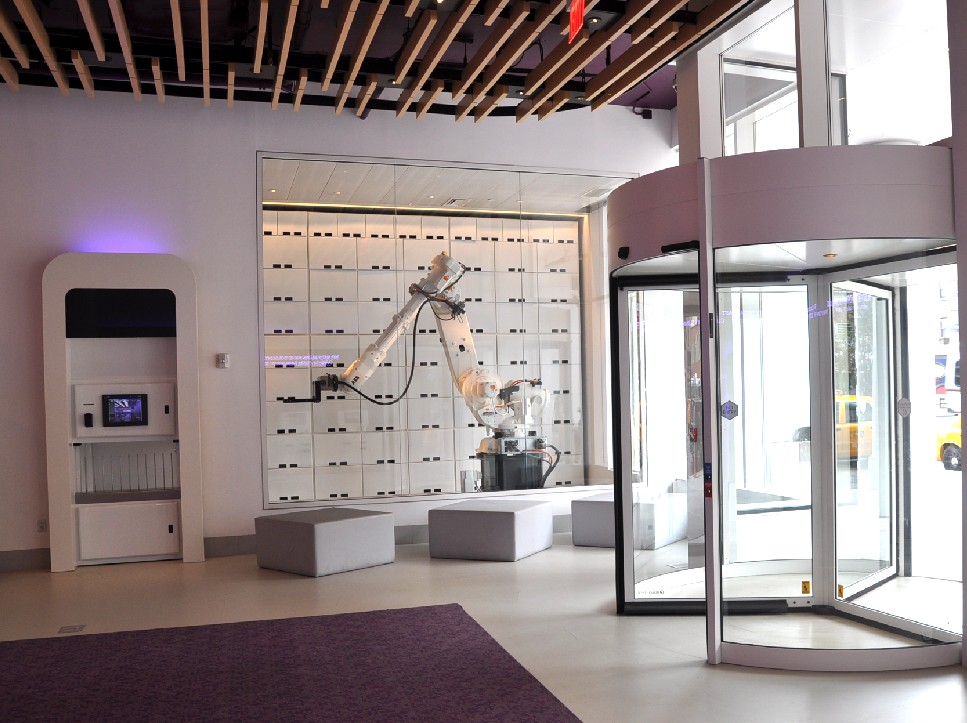 ABB articulated-arm industrial robot serves as automated luggage-storage and -retrieval system